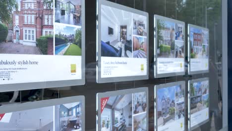 Exterior-of-Savills-estate-agents-in-Ealing-showcasing-properties-London-United-Kingdom-June-2024