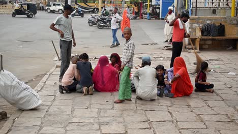 Big-family-waits-for-the-bus-to-arrive-so-they-can-travel-back-home