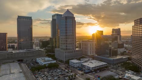 Sunset-over-Tampa-downtown-skyline,-featuring-modern-skyscrapers-and-a-warm-golden-sunset-in-the-background