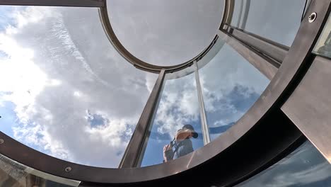 Ascending-the-circular-elevator-shaft-of-the-Visitors'-Centre-at-the-Citadel-in-Victoria,-Gozo,-Malta