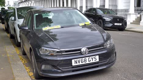 Car-covered-in-parking-tickets-in-London-United-Kingdom-June-2024