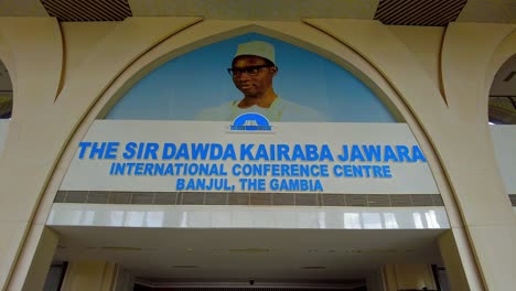 Portrait-of-former-president-Sir-Dawda-Kairaba-Jawara-at-entrance-of-SDKJ-Conference-Centre,-Static