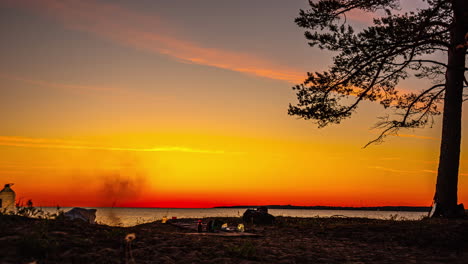 People-time-lapse-camping-ground-in-forest,-early-morning-sunrise-gold-sky