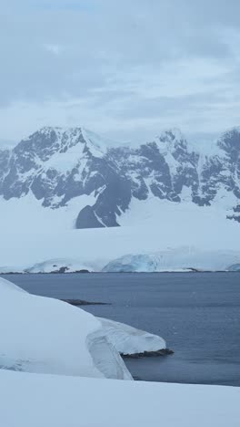 Antarctica-Winter-Scenery-of-Mountains-and-Glacier,-Beautiful-Dramatic-Antarctic-Landscape-with-Snow-Ice-and-Snowcapped-Mountain,-Vertical-Video-for-Social-Media,-Instagram-Reels-and-Tiktok