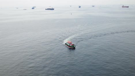 Aerial-Drone-Video-Captures-Coast-Guard-Patrol-Navigating-Through-The-Tranquil-Ocean