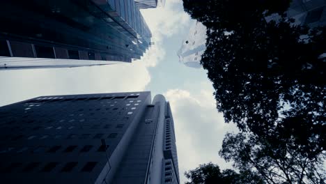 Abstract-slow-motion-looking-up-driving-through-the-business-district-in-Singapore