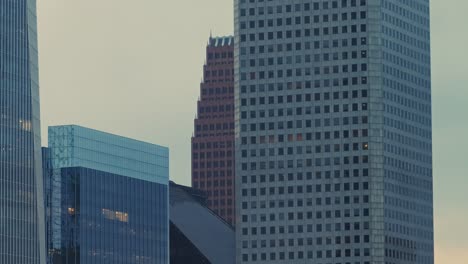 Close-up-shot-of-Houston's-skyscrapers-with-a-reveal-of-another-skyscraper