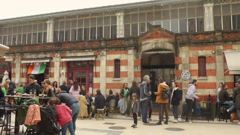 Exterior-view-of-the-crowded-historic-market-of-La-Rochelle-in-France