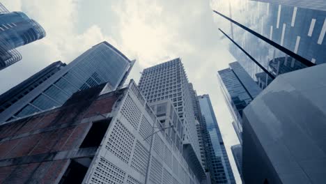 Abstract-slow-motion-looking-up-driving-through-the-business-district-in-Singapore