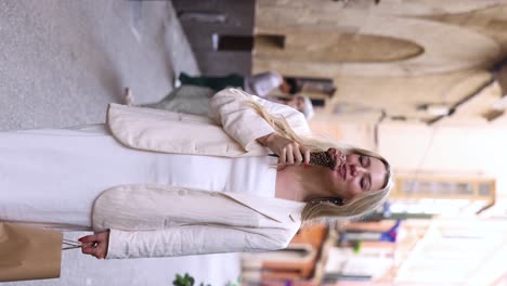 Vertical---Attractive-Female-Traveler-Enjoys-Eating-Gelato-In-Palma-de-Mallorca,-Spain