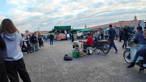 Jemaa-el-Fnaa-main-square-street-performance,-touristic-Marrakech-Morocco