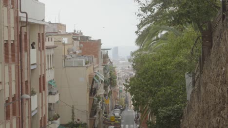 Barcelona-in-Catalonia,-Spain,-view-from-top-of-residential-street,-day-time