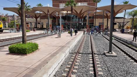 Train-station-and-railway-of-Marrakesh,-Morocco,-people-boarding