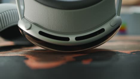 Close-up-view-of-the-top-side-of-Apple-Vision-Pro-VR-headset-resting-on-a-desk