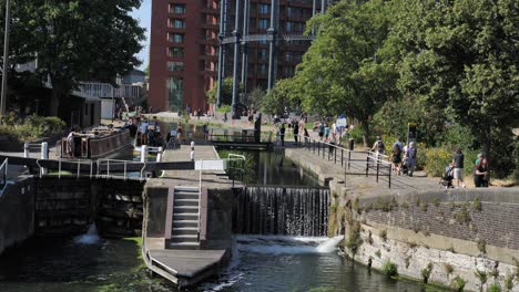 House-boats-leaving-St-Pancras-Lock,-King's-Cross,-London,-UK,-July-2023