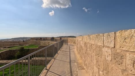 Walking-along-the-ancient-walls-at-the-historical-site-of-Gozo,-Malta,-showcasing-the-rich-cultural-heritage-and-breathtaking-views