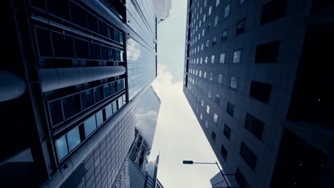 Abstract-slow-motion-looking-up-driving-through-the-business-district-in-Singapore