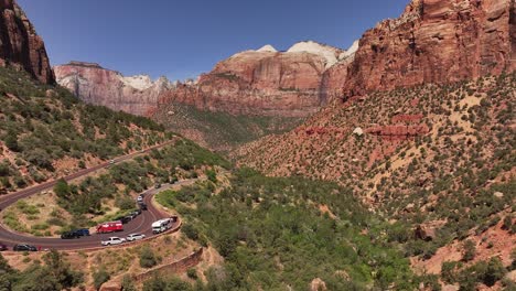 Aerial-perspective-of-Zion-National-Park-illuminated-by-sunlight,-a-pristine-nature-preserve-in-southwest-Utah