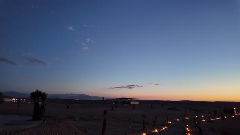 Agafay-desert,-bedouin-camp-after-sunset,-clear-sky,-light-up-patchway