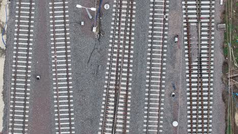 Top-down,-slow-drone-shot-of-traintracks