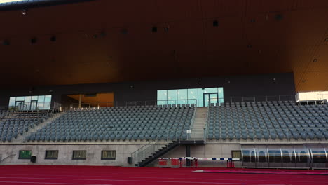 Bleachers-and-Track-Janis-Dalins-Stadium-in-Valmiera,-Latvia-in-low-angle-view