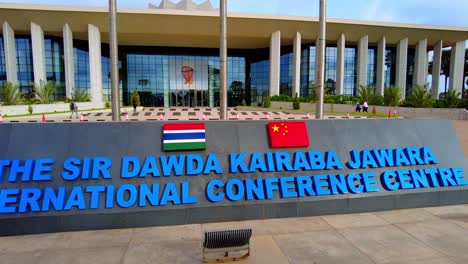 SDK-Jawara-conference-centre-lettering-during-OIC-Banjul-summit-at-building-front-closeup-pan