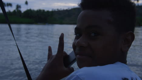 Smiling-Fijian-man-lifts-hand-stoked-and-happy-with-excitement-for-the-day