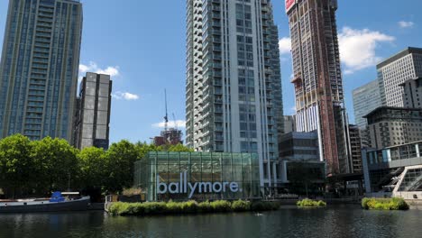 View-of-modern-skyscrapers-and-Ballymore-property-developers'-logo-along-the-Thames-river-in-Isle-of-Dogs,-London,-UK,-July-2023