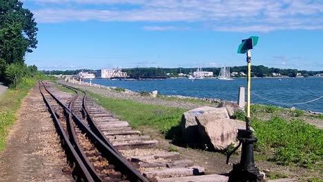 Narrow-guage-railroad-switching-sign-on-trail-in-Portland,-Maine