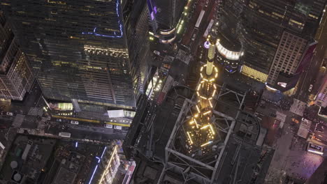 NYC-New-York-Aerial-v353-zoomed-birds-eye-view-vertical-flyover-Midtown-Manhattan-capturing-flashing-lights-in-Times-Square-and-modern-skyscrapers-at-dusk---Shot-with-Mavic-3-Pro-Cine---September-2023