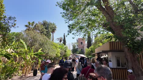 Tourists-at-the-entrance-of-Bahia-Palace,-landmark-in-Marrakesh-Morocco