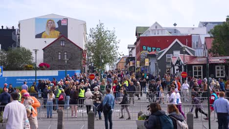 Crowd-on-Streets-of-Reykjavik,-Iceland,-People-and-Colorful-Buildings,-Slow-Motion