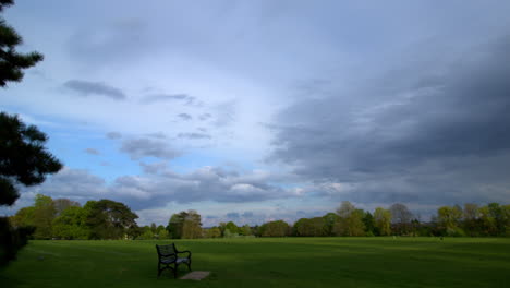 Time-lapse-of-sunset-clouds-on-a-sunny-summer-day-with-Avery-Hill-House-in-Avery-Hill-Park,-in-London,-UK