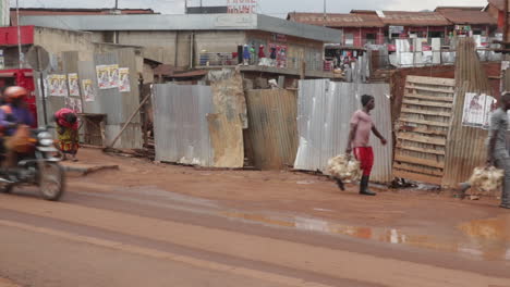 people-walking-established-street-view-of-traffic-road-after-rain-in-small-village