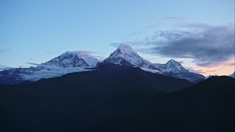 Nepal-Mountains-Scenery-at-Night,-Poon-Hill-Viewpoint-at-Dawn-with-Amazing-Dramatic-Landscape-of-Big-Tall-High-Snowcapped-Mountain-Tops-and-Summits,-Annapurna-South-Peak-while-Trekking-on-Trek