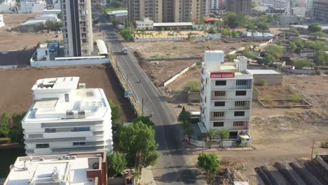 side-where-large-high-rise-buildings-and-detached-and-farm-and-school-are-visible