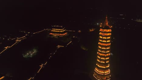 Nighttime-beauty-of-illuminated-temples-in-Ninh-Binh,-Vietnam