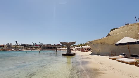 Blue-flag-beach-club-in-Izmir-Cesme-Alacati,-beach-umbrellas,-chairs,-beach-party