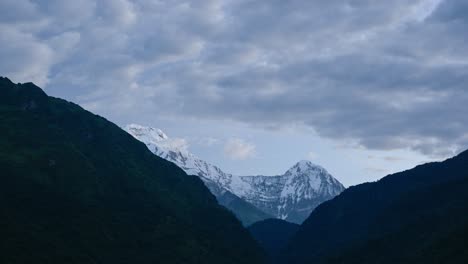 Nepal-Timelapse-of-Himalayas-Mountains,-Time-Lapse-of-Clouds-Moving-over-Annapurna-Mountain-Range,-Getting-Light-in-Night-to-Day-Dark-Blue-Beautiful-Landscape-Scenery,-Background-with-Copy-Space