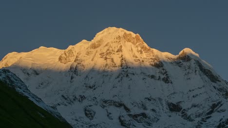 Nepal-Mountains-Sunrise-Timelapse,-Himalaya-Time-lapse-of-Shadow-Moving-on-Face-of-Mountain-with-Sun-Rising-on-Snowcapped-Winter-Mountain-Top-Peaks-and-Summit,-Beautiful-Landscape-Scenery