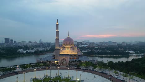 A-stunning-aerial-shot-of-the-Putra-Mosque-in-Putrajaya,-Malaysia-during-the-evening