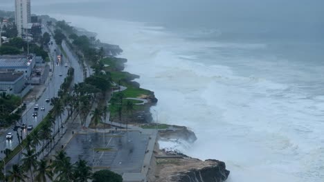 Massive-waves-break-at-Caribbean-coastline,-dangerous-hurricane-Beryl,-drone