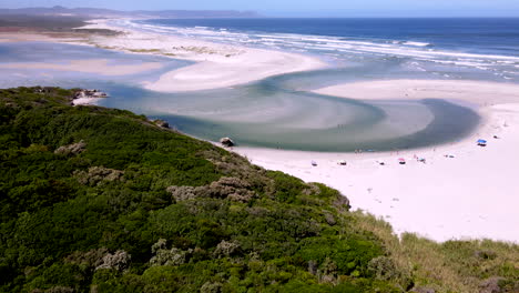 Drone-dolly-reveals-scenic-setting-of-Klein-River-lagoon-in-Grotto-Hermanus