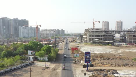 aerial-drone-view-where-many-big-high-rise-buildings-and-many-vehicles-are-driving-on