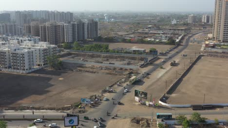 Drone-camera-is-moving-forward-where-there-are-many-vehicles-driving-on-the-road