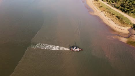 Motorised-barge-crossing-serene-lagoon,-tranquil-waters,-sandy-banks-and-coastal-beauty---Kei-Mouth,-Transki,-Eastern-Cape,-South-Africa