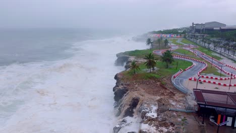 Impressive-aerial-drone-view-of-Hurricane-Beryl-hitting-Santo-Domingo-coastline-with-huge-waves,-Dominican-Republic