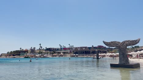 Blue-flag-beach-club-in-Izmir-Cesme-Alacati,-beach-umbrellas,-chairs,-beach-party