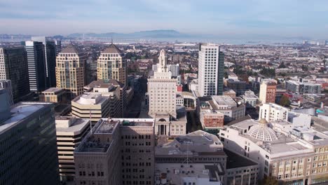 Aerial-View-of-Oakland-City-Hall-and-Downtown-Buildings,-Establishing-Drone-Shot,-California-USA