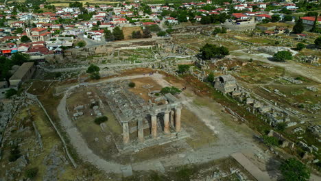 Aerial-view-circling-the-Temple-of-Apollo-ruins,-sunny,-summer-day-in-Greece